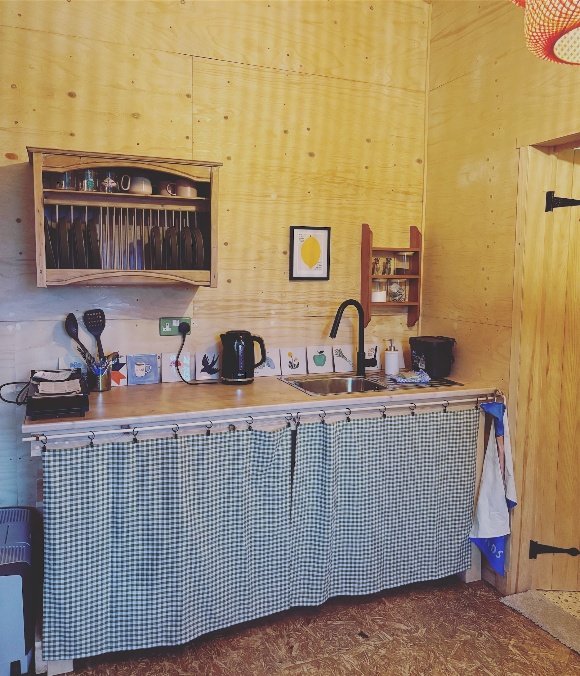 The cabin kitchenette with handmade pottery